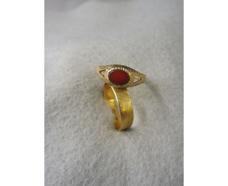 An 18ct gold wedding band and a 9ct gold ring.
