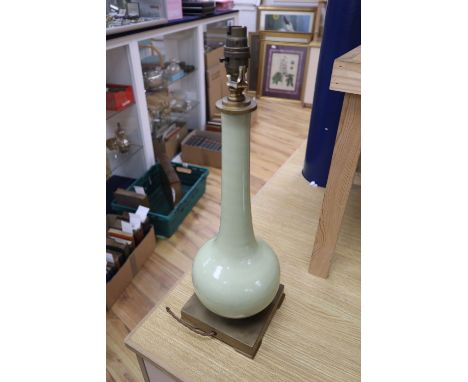 A French duck egg blue porcelain bottle neck vase converted to a table lamp, brass plinth, c.1970, height 46cm. Provenance: T