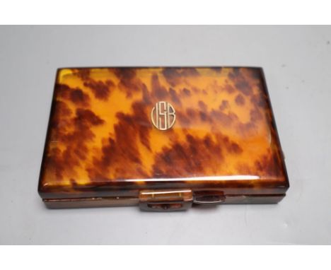 A 1930's tortoiseshell compact, 14cm
