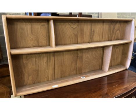 An Ercol light elm plate rack, width 106cm, height 49cm