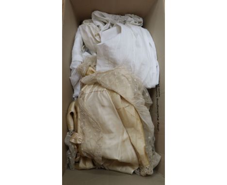 A cream silk and lace christening cape together with a collection of baby and childrens clothing