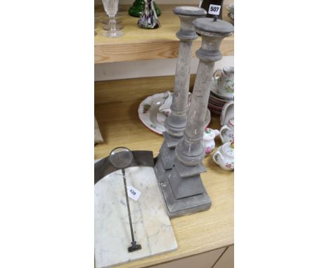 A sunshine recorder and a pair of marble candlesticks