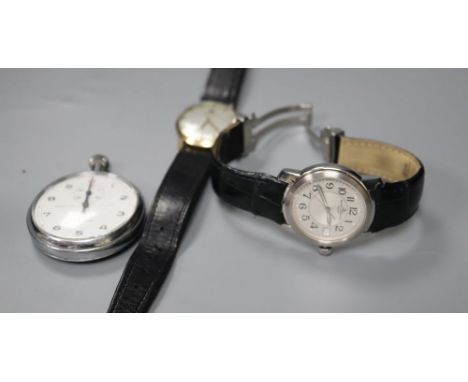 A gentleman's 1970's 9ct gold Tissot watch, a Baume &amp; Mercier steel watch and a Lemania stopwatch.
