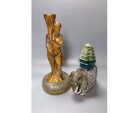 A late Victorian painted moulded glass candlestick, height 29cm, and a Rosenthal porcelain ceremonial elephant model, 19cm