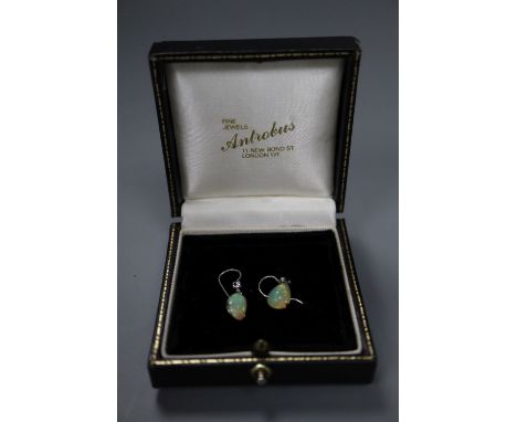 A pair of white metal and pear shaped opal and diamond set drop earrings, opal 12mm, gross 2.6 grams.