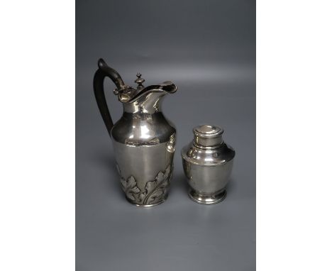 A George V silver tea caddy by George Unite &amp; Sons, 10.7cm and a silver water jug, gross 14 oz.