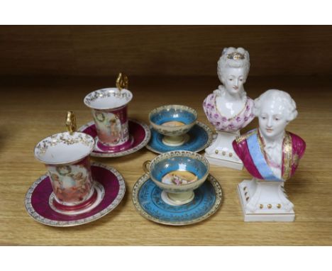 A pair of German porcelain busts of Louis XVI and Marie Antoinette, tallest 16cm, and four cups and saucers