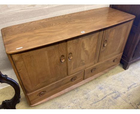 An Ercol light elm three door sideboard, width 130cm, depth 48cm, height 76cm