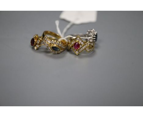 Four assorted modern rings, including 18ct gold sapphire and diamond cluster ring, an 18ct gold, ruby and diamond cluster rin