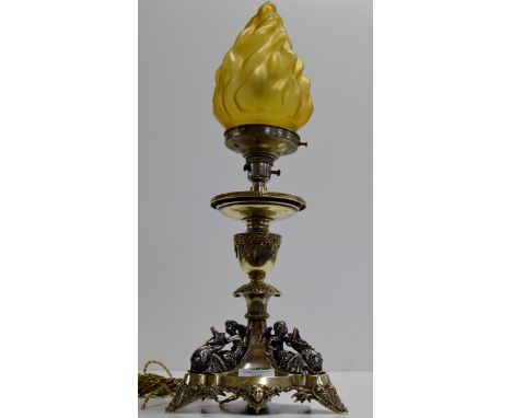 AN UNUSUAL 19¼" ART DECO WHITE METAL TABLE LAMP WITH FACE MASK MOTIFS  & APPLIED MOUNTS MODELLED AS CHERUBS & DRAGONS, WITH A