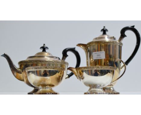 A 4 PIECE SILVER PLATED TEA SERVICE COMPRISING TEAPOT, HOT WATER POT, SUGAR & CREAM     