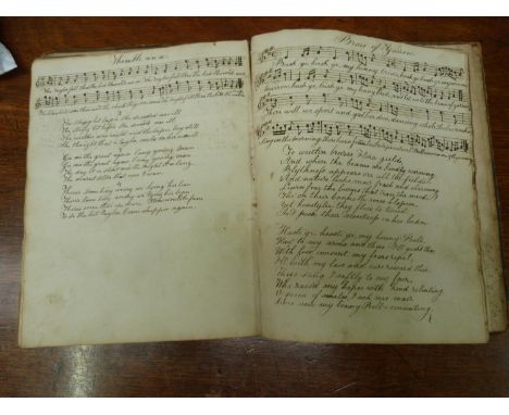 Scottish Songs - Manuscript.  Manuscript quarto vol. of Scottish songs with accompanying music & poetry. Approx. 120pp. Brds.