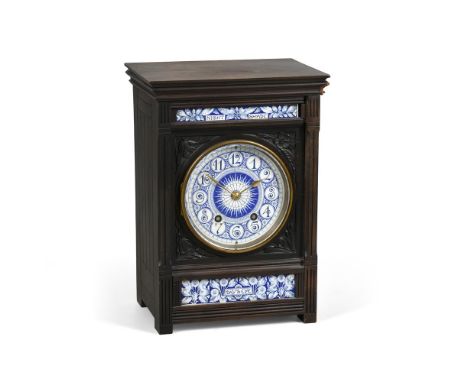 AN AESTHETIC MOVEMENT EBONISED AND PORCELAIN INSET MANTEL CLOCK  CIRCA 1890, ATTRIBUTED TO LEWIS FORMAN-DAY With eight-day 't