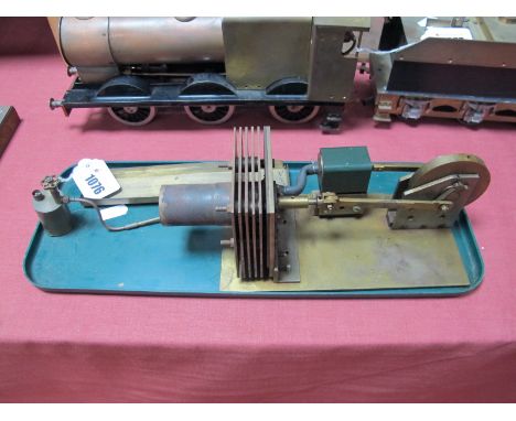 A Stirling Type Hot Air Engine, with single piston of one inch stroke connected to a 2.5 inch solid brass flywheel, supplied 