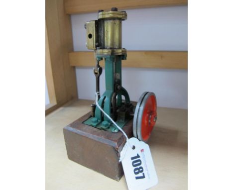 A Single Cylinder Vertical Steam Engine, of 0.5 inch bore and one inch stroke, connected to a 2 inch flywheel, overall dimens