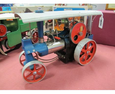 A Wilesco D40 Live Steam Traction Engine, unboxed, in good condition, finished in blue and red, missing burner.