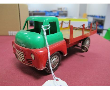 A Mid XX Century Four Wheel Tinplate and Plastic 'Chain Flatbed' by Wells-Brimtoy, clockwork, 18cm long.