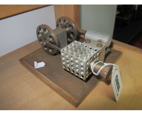 A Stirling Type Hot Air Engine, connected to twin flywheels of two 2 inch diameter, overall size 5.5 inch square by 3 inch hi