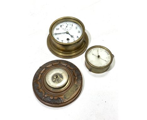 Early 20th century brass bulkhead clock, white enamel dial with Arabic chapter ring and subsidiary seconds hand, (D19cm) toge