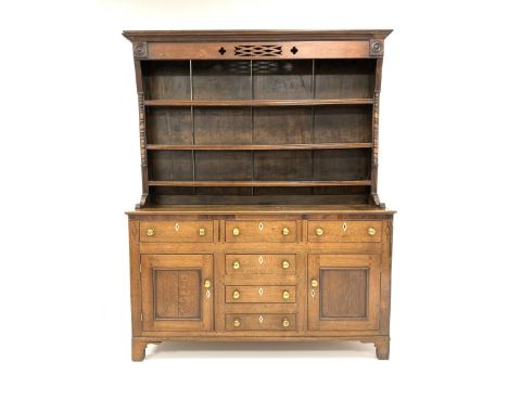 19th century oak and mahogany banded dresser, projecting cornice over pierced frieze on three height plate rack, four drawers