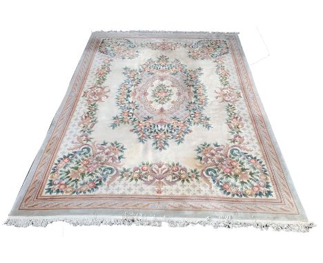 Large Chinese washed wool carpet with floral medallion and spandrels on an ivory field enclosed by border,  - Condition Repor