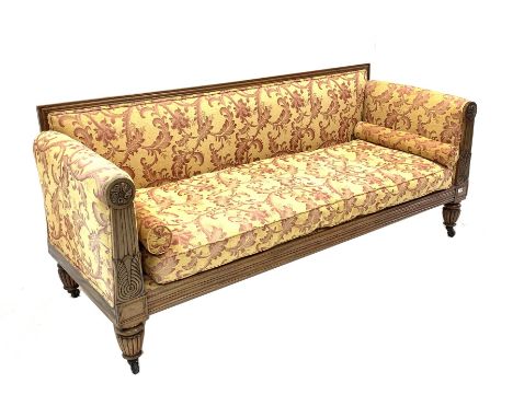 Early 19th century rosewood sofa, moulded crest rail and leaf carved arm terminals with floral roundels, back, seat, arms, an