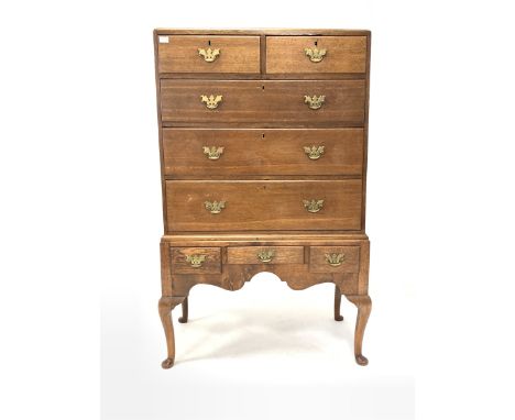 Mid 19th century oak chest on stand, the top section fitted with two short and three long graduated drawers, three drawers an