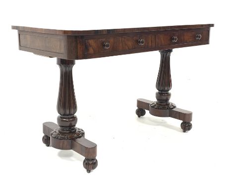 William IV rosewood library table, the well figured rectangular top over two drawers, raised on two baluster turned and lobe 