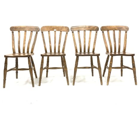 Set of four country elm and beech dining chairs, with shaped seats raised on ring turned supports and stretchers - Condition 