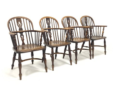 Set four early to mid 19th century elm and ash Windsor armchairs, having hoop, spindle and pierced splat backs over shaped se