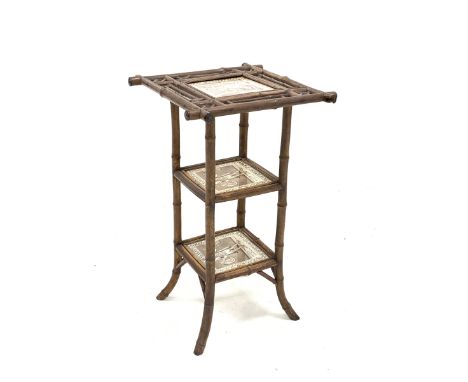 Victorian Aesthetic style bamboo occasional table, with three tiers each inset with a tile depicting a scene from 'Twelfth Ni