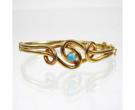 An early 20th century gold and set turquoise hinged bangle, of interlaced design, marks rubbed, 7.5g, 6cm wide