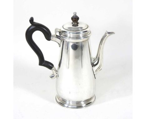 An early 20th century silver coffee pot, of tapered shape, with an ebonised handle and finial, by Tiffany &amp; Co, no 22938,