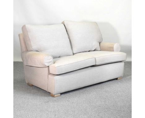 A Multiyork cream upholstered two seater sofa150w x 80d x 90h cm