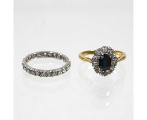 A gold, sapphire and diamond cluster ring, 3.6g, size N, together with a diamond set full hoop eternity ring, size L (2)