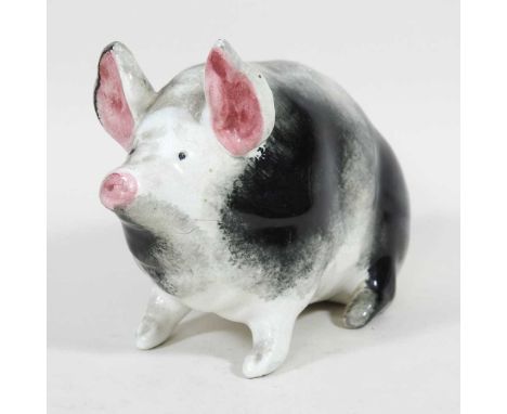 An early 20th century Wemyss model of a pig, with black and white markings, impressed marks, 16cm long