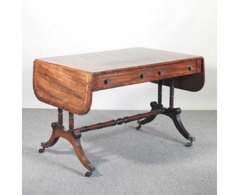 A Regency mahogany and rosewood crossbanded sofa table, on a splayed base, 107cm wide, together with a George III folding tea