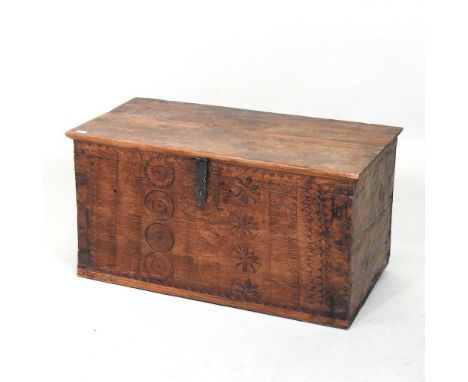 An Eastern carved hardwood trunk, with a hinged lid66w x33d x 35h cm