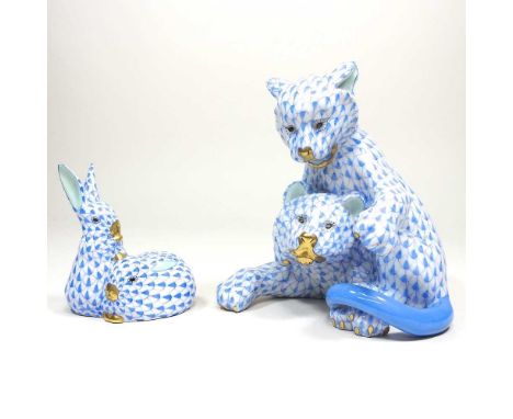 A Herend porcelain model of a pair of cubs, 14cm high, together with another group of rabbits, each in blue fishnet pattern (