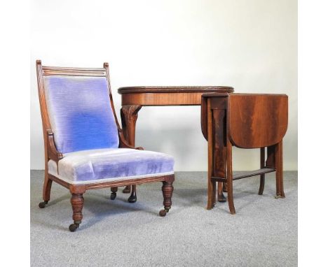 An early 20th century walnut poker table, together with an Edwardian sutherland table and a Victorian blue upholstered side c