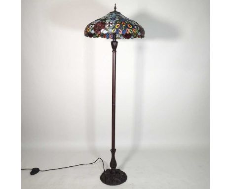 A Tiffany style standard lamp, with a stained glass shade, 160cm high overall