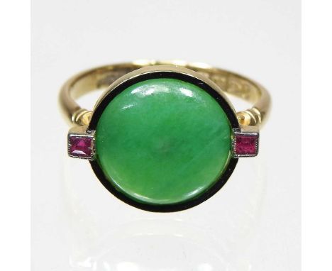 An 18 carat gold jade ring, set with two rubies, 4.3g, size POverall complete and wearable. The stone is a bright colour and 