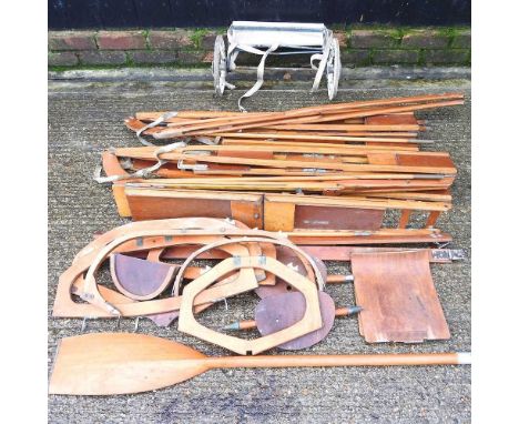 A mid 20th century Granta wooden canoe, in kit form, by Granta Boats, Cottenham, folding into a bag, on a trolley, with paddl