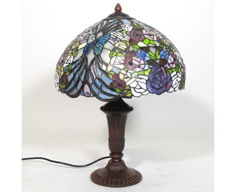 A Tiffany style table lamp, with a stained glass shade, 57cm high overall