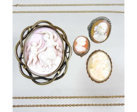 A large early 20th century cameo shell brooch, carved with classical figures, within a gilt openwork surround, 7 x 6cm, toget