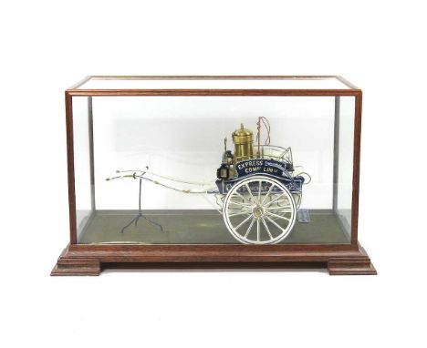 A scratch built painted wooden model of a dairy cart of circa 1900, in a glazed wooden display case, 46cm long
