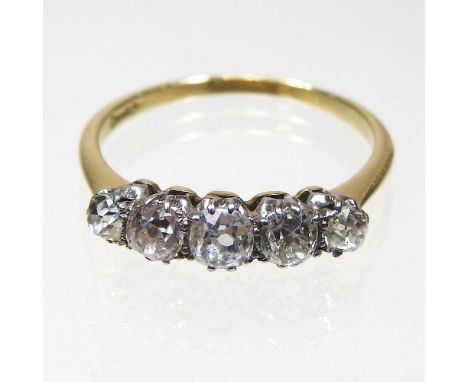 An 18 carat gold five stone ring, set with a single row of graduated stone, approximately 1.0 carats gross, 2.4g, size O