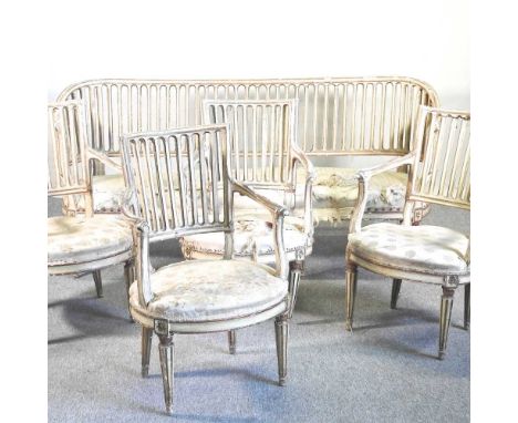 A 19th century French painted part salon suite, comprising a show frame sofa, 182cm wide and a set of four armchairs, with up