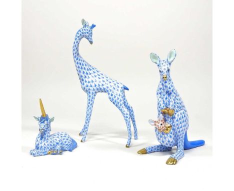 A Herend porcelain model of a giraffe, 20cm high, together with a kangaroo and a unicorn, all in blue fishnet pattern (3)Over