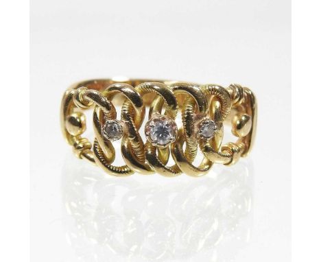 An 18 carat gold diamond three stone ring, of interlaced design, set with a row of graduated stones, 6.7g, size V